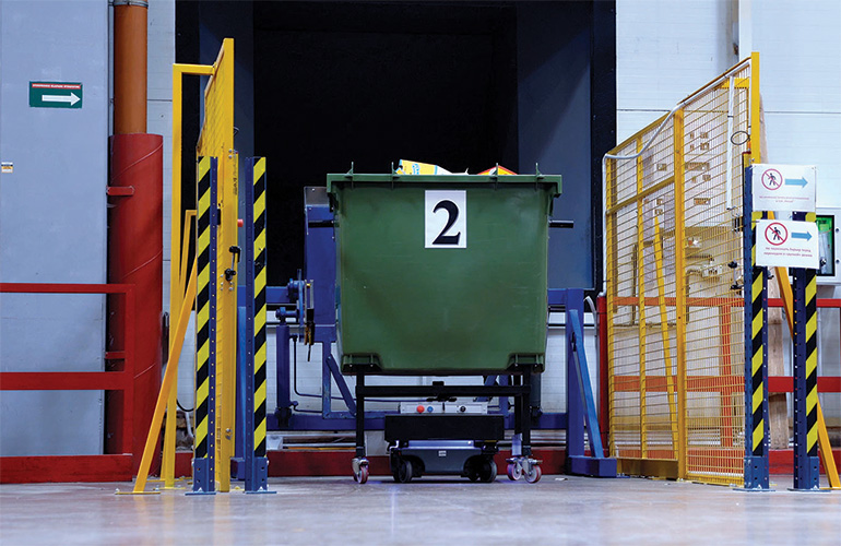 MIR 500 AMR moves a large waste collection bin