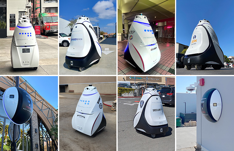lineup of eight knightscope robots in the field.