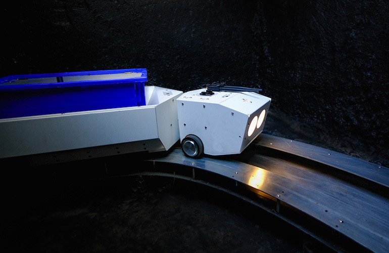 A Pipedream delivery robot travels through its underground tunnel to deliver goods.