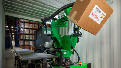 A Pickle trailer-unloading robot demonstrates picking up a 50-lb. box.