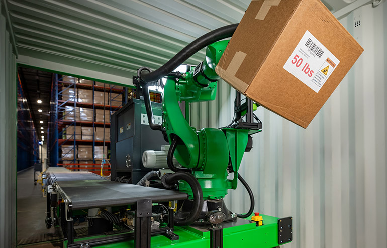 A Pickle trailer-unloading robot demonstrates picking up a 50-lb. box.