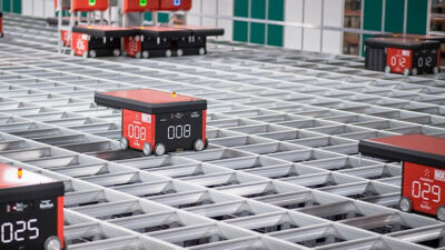 autostore robots run around on top of the storage array.