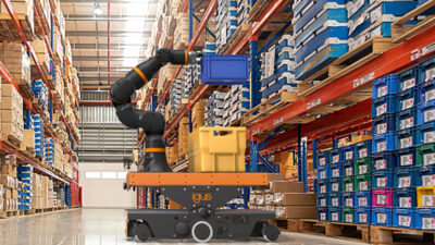igus' new ReBeL Move automated guided vehicle, and flat, orange and grey AGV, with a cobot arm attached to the top.