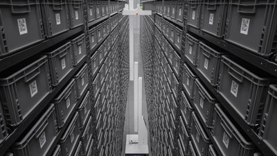 Brightpick Giraffe can retrieve and place totes on shelves up to 20 ft. high, as shown here.