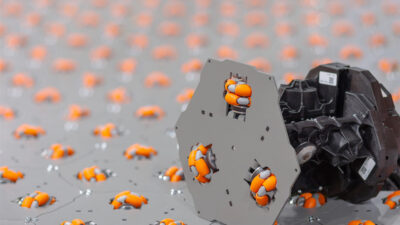 An image of Cellumation's unique conveyor technology which uses hexagon-shaped pieces with three omni-directional rollers.