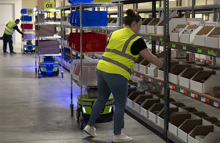 Tools such as wearables, AI, and these mobile robots can help warehouse workers, says Zebra Technologies.