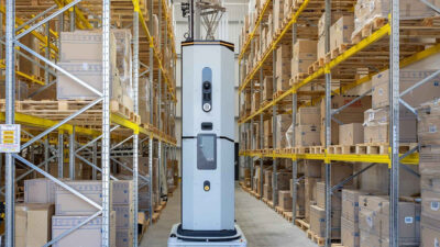 Dexory's DexoryView autonomous mobile robot (AMR) moving through a warehouse.