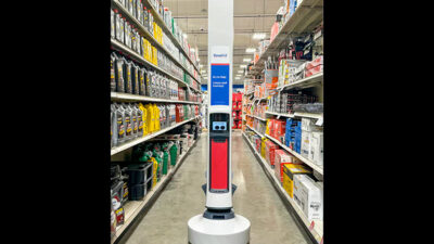 a simbe Tally mobile robot in the aisle at a Theisen's store.