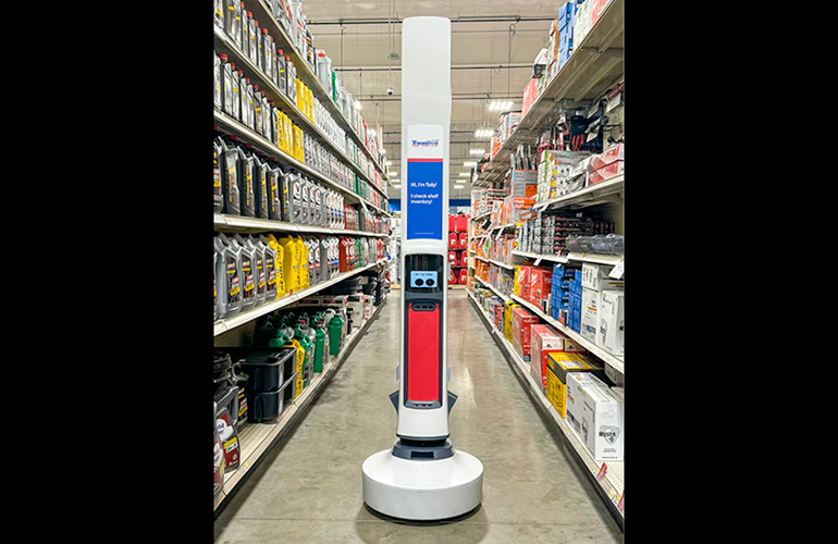 a simbe Tally mobile robot in the aisle at a Theisen's store.