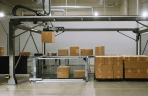 The AmbiStack system from Ambi Robotics picking up a box.