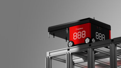 A red AutoStore robot at the top of a grid.