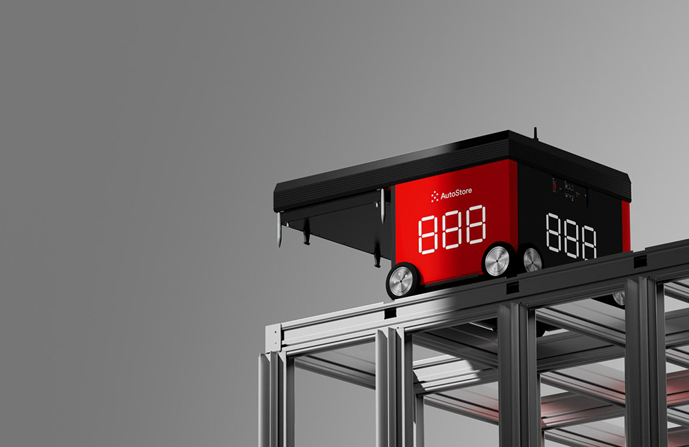 A red AutoStore robot at the top of a grid. Stellantis will handle automotive parts in its Megahub.