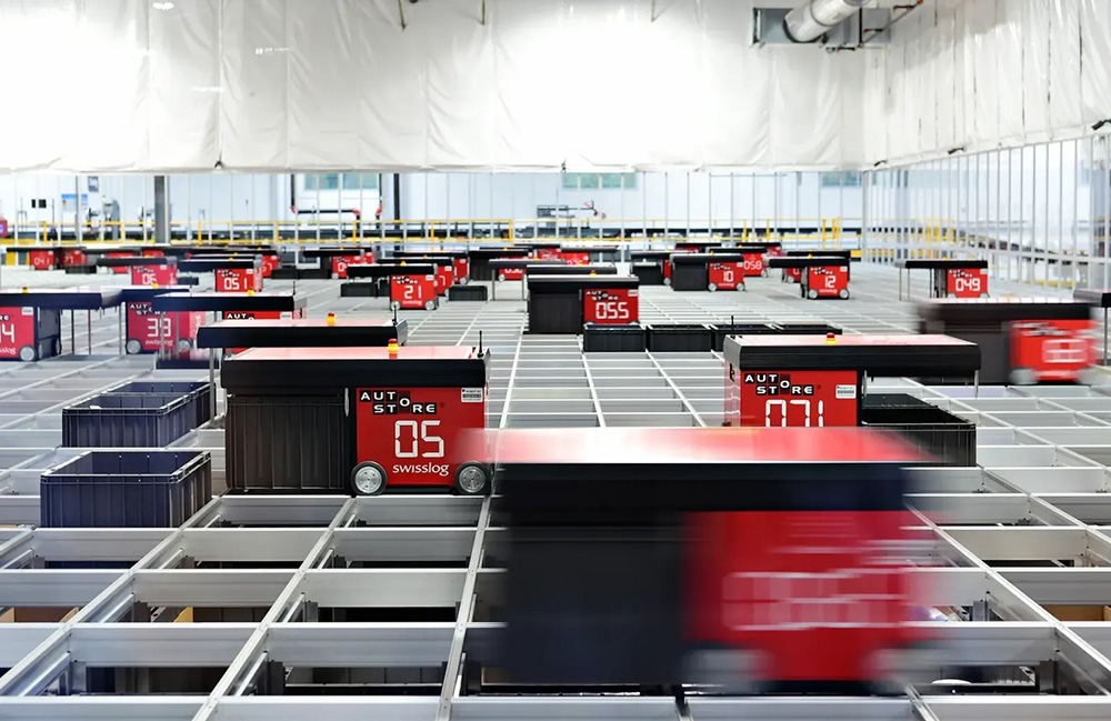 An image of the top of an AutoStore ASRS where robot shuttles move across the top of the structure.