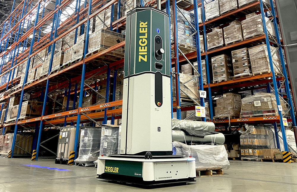 Dexory's DexoryView robot with Ziegler branding moving through a warehouse.
