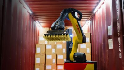 A Boston Dynamics Stretch robot unloading a container for DHL.