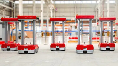 Five red Zippy sorting robots from Addverb in a warehouse.