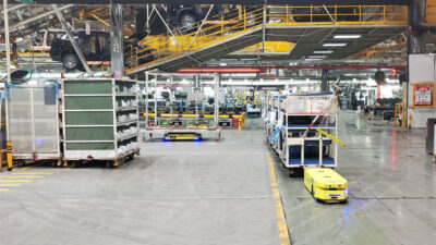 ForwardX Lynx towing AMRs at work in Chery Automotive's Kaifeng Factory's Final Assembly Workshop.