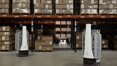 Two Locus robots in a warehouse.