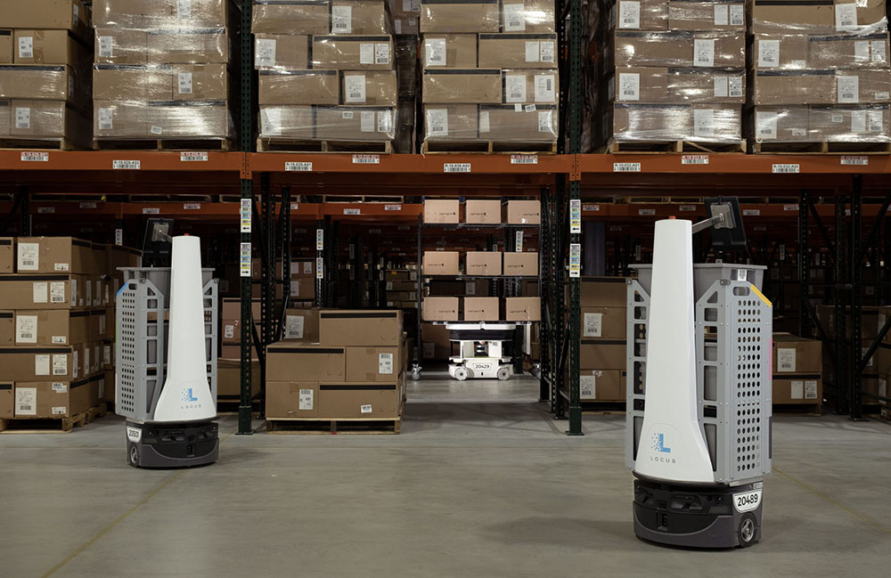 Two Locus robots in a warehouse.