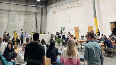 Mytra CEO Chris Walti talks at a company staff meeting in the new facility.