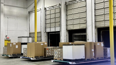 Slip Robotics customers include automotive manufacturers, with parts shown loaded on SlipBots here.