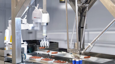 FANUC America will demonstrate the DR-3iB/6 Stainless IP69K-rated delta robot and a food-grade SR-12iA/C SCARA robot placing sausage links in packages.