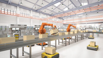 Robot arms and AMRs working together in a warehouse.