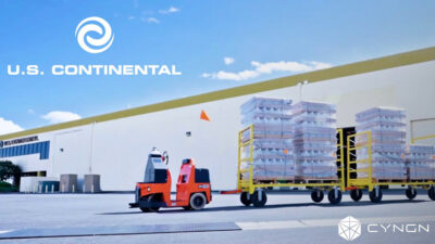 Cyngn's DriveMod Tugger pulling two carts full of product.