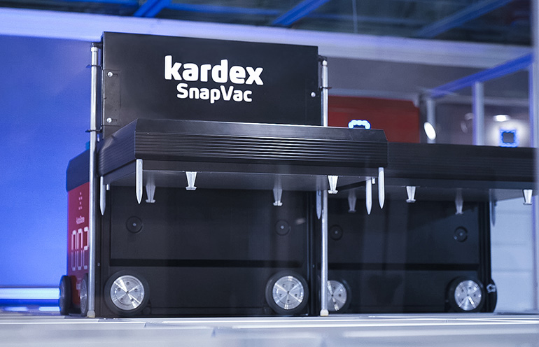 Kardex photo of SnapVac, which attaches to AutoStore shuttles to clean ASRS racks.