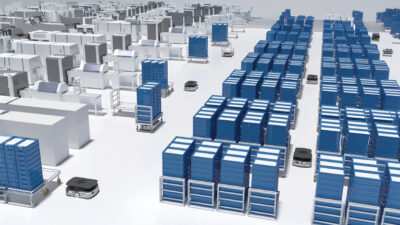 Computer-generated image of mobile robots in a warehouse. 'Latent lifting' AMRs are designed for precise positioning in warehouses and factories, says iRAYPLE.