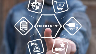 A person pressing a fulfillment button with other images around it.