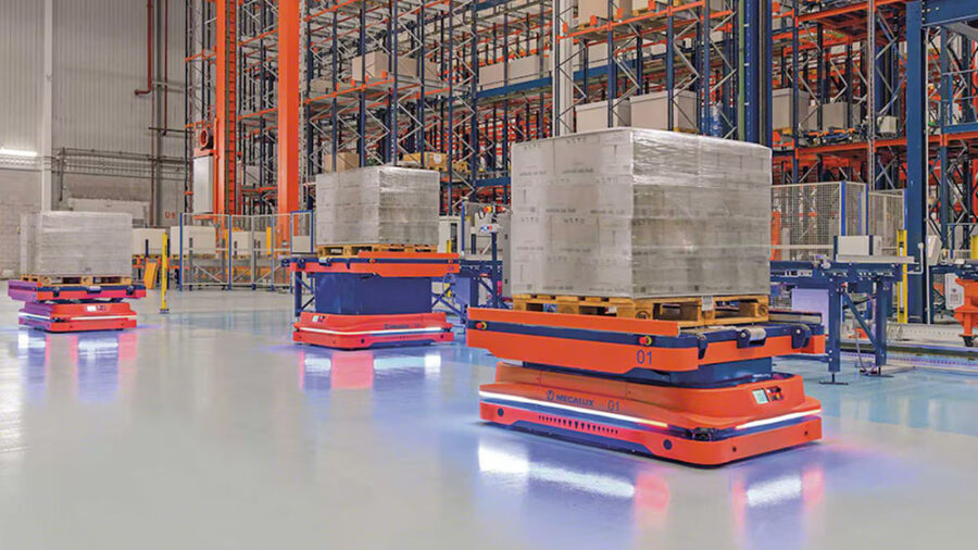 Orange AMRs moving in a warehouse.