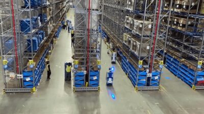 Locus Origin AMRs work with warehouse associates for putaway, fulfillment, and reverse logistics.