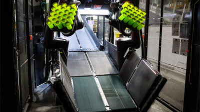 Berkshire Grey's Scoop unloading robot at a FedEx facility.