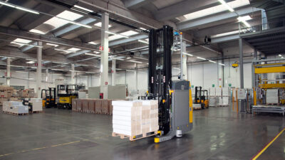 An autonomous forklift in a warehouse.